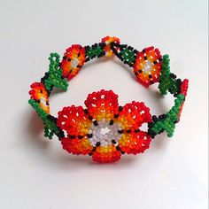 a beaded bracelet with flowers on it