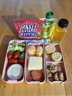 the lunch box is filled with different types of food and drinks, along with snacks