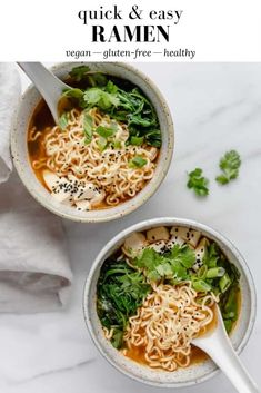 two bowls of soup with noodles and greens