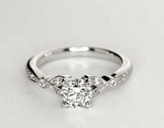 an engagement ring with three stones on the side