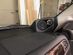 the interior of a car with speakers in it