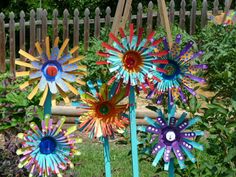 three colorful pinwheels are sitting in the grass