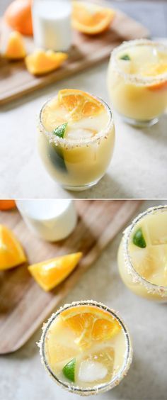 two shots in glasses with orange slices and mint garnish on the rims