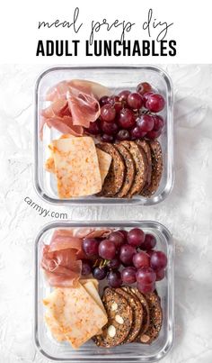 two plastic containers filled with meat, cheese and crackers next to grapes on the side