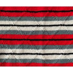 a red, grey and white striped rug