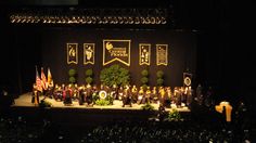 a group of people standing on top of a stage