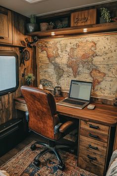 a laptop computer sitting on top of a wooden desk next to a chair and window