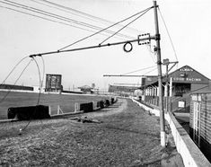 an old black and white photo of a train on the tracks