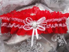 Made in sizes 14"-26" garter width is 2.95" Please send the circumference of your leg after making the purchase. I will make a garter according to your information. How to Measure for a Wedding Garter ~ Wrap a measuring tape around your thigh where you plan to wear your garters. Garters are typically worn about 3 inches above the knee. Look at the number where the measuring tape overlaps itself. This is the size of your thigh, which will guide you in knowing what size garter you'll need. Write i Red And White Wedding, Prom Garters, Garter Lace, Red And White Weddings, Garter Wedding, Wedding Garters, Lace Garter, Red Belt, Wedding Garter