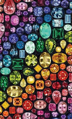 many different colored stones are arranged in the shape of a rainbow - hued diamond