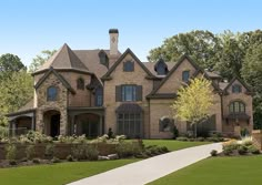 a large brick house with lots of windows