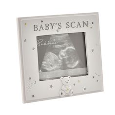 a baby's scan photo frame with a teddy bear and stars on the side