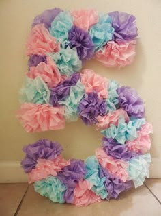 the letter c made out of tissue paper flowers