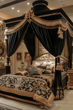 a fancy bed with black and gold decor in a large room, it has a chandelier hanging from the ceiling