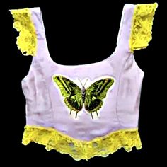 This corset style top has a beautiful butterfly, yellow lace accents and adjustable ribbons for length and width to provide a personalized fit. Sweetie Butterfly Top, Corset Butterfly, Rapunzel Corset Top, Y2k Butterfly Top, Butterfly Corset, Pink Butterfly Corset Top, Corset Style Tops, Yellow Lace, Corset Style