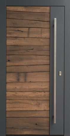 a close up of a wooden door with a metal handle on the front and side