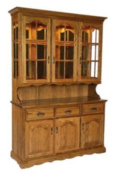 a wooden hutch with glass doors and drawers on it's front door,