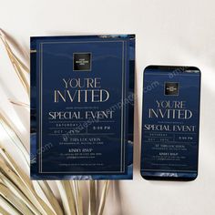 an elegant blue and gold event ticket with palm fronds next to it on a white surface