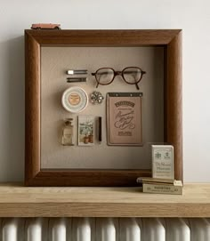 a wooden frame with various items in it