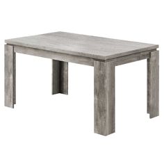 a wooden table sitting on top of a white floor