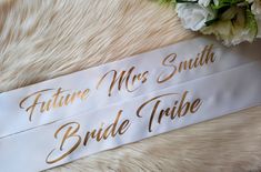 **Pack Information** This sash comes as pictured in the font shown. This item is fully personalized ,please provide the details required when ordering.- Please Ensure spelling is correct as we will spell as provided. This sash can be made in any sash and print colour of your choice. This sash can be bought on its own or as part of a pack **Product Information** Our sashes are a Satin sash with a luxury soft feel. Our sashes are open ended not sewn allowing you to fit and adjust to your perfect size. We Supply sash pins with every purchase. Our sashes are 165cm standard size. We offer plus and children size sashes- please contact us.please note  if no sash colour is noted during your  checkout  we will make in  the default WHITE colour satin sashplease note if no sash colour is noted during Bride To Be Sash Diy, Lace Bride Sash, Bride Sash Bachelorette, Silver Crystal-embellished Bridesmaid Sash, Hen Party Sash, Bride To Be Sash, Satin Sash, Bride Tribe, Wedding Accessories