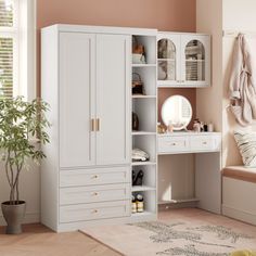 a bedroom with white furniture and pink walls