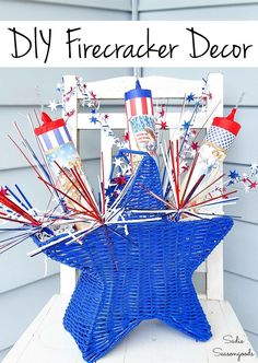 a blue wicker basket with red, white and blue decorations in it on a porch