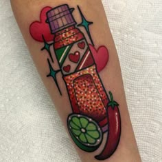 a colorful tattoo design on the leg of a woman's leg with a bottle and lime