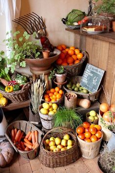 many baskets filled with different types of fruits and vegetables