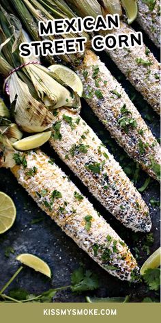 mexican street corn with limes and cilantro on the side