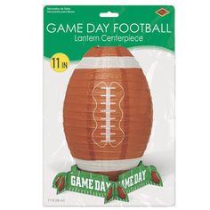 a paper lantern shaped like a football with the name game day on it's side