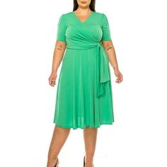 Product Description: Step into elegance with the Plus Size Stylish Solid Faux Wrap Dress featuring a Deep V-Neck. This chic and sophisticated dress is designed to flatter your curves while providing ultimate comfort. The faux wrap design creates a beautiful silhouette, and the deep V-neck adds a touch of allure. Crafted from high-quality, stretchable fabric, this dress is perfect for any occasion, from casual outings to formal events. Available in a range of solid colors, it's a versatile additi Plus Size Flowy Dress, Black Plus Size Dress, Moa Collection, Casual Sundress, Plus Size Summer Dresses, Dot Print Dress, Beautiful Silhouette, Evening Dresses With Sleeves, Loose Maxi Dress