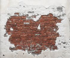 an old brick wall with peeling paint and chipped paint on it, in the middle of