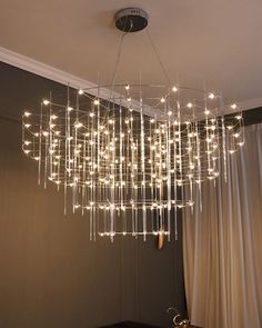 a chandelier hanging from the ceiling in a room