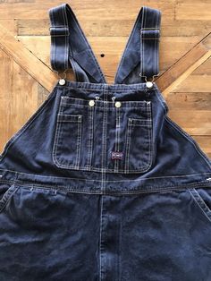 "There's no interior tags on these ol' Big Smith overalls and I provided measurements in the photos for an accurate fit. They best fit a XXL and can be adjusted into as long as 64\" In total length. They appear to have been worn cuffed for a long period of time as there's some distress at the lower legs. They're a deep indigo denim and are super soft, durable cotton with all the original hardware in tact and functioning shoulder adjustable straps and zip fly. These are well worn and have tons of character, please refer to the photos for an accurate reflection of the condition ✨(4)" Utility Dark Wash Shortalls With Pockets, Utility Style Dark Wash Shortalls With Pockets, Dark Wash Cotton Shortalls With Pockets, Dark Wash Relaxed Fit Shortalls With Pockets, Relaxed Fit Dark Wash Shortalls With Pockets, Dark Wash Denim Shortalls With Pockets, Denim Shortalls With Pockets In Dark Wash, Fall Denim Shortalls With Pockets, Vintage Dark Wash Cotton Denim Jumpsuit