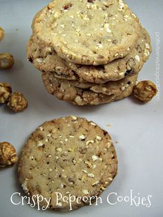 three cookies stacked on top of each other with walnuts around the edges and one cookie in the middle