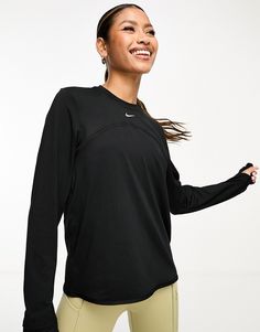 Tops by Nike Running Hit that new PB Crew neck Long sleeves Thumbhole cuffs prevent sleeves from riding up Reflective details for increased visibility in low lighting Zip side pocket Regular fit Athletic Tops Long Sleeve, Long Sleeve Sports Shirt, Running Long Sleeve, Long Sleeve Sports T-shirt, Running Fits, Fitness Fits, Thrift Manifestation, Long Sleeve Gym Tops, Nike Running Shirt