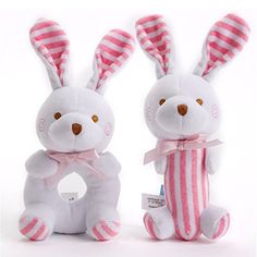 two stuffed animals with pink and white stripes on them, one is holding a ring