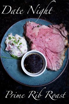 a blue plate topped with meat and mashed potatoes