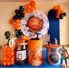 an assortment of basketball themed decorations and balloons