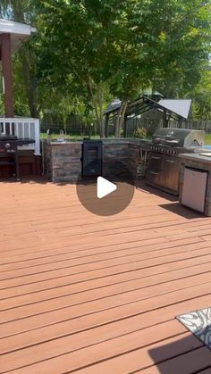 an outdoor kitchen and grill area is shown in this screenshot from the outside deck