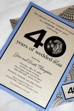 an anniversary party card with the number 40 on it and a photo of two people