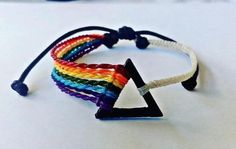 a multicolored bracelet with a triangle on it