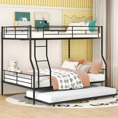 a black metal bunk bed sitting on top of a hard wood floor