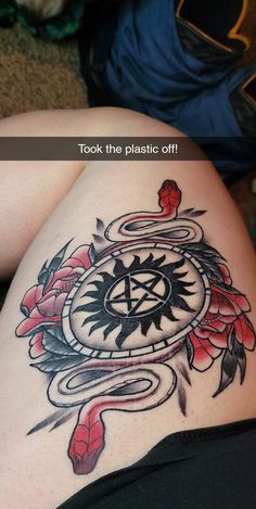 a woman's thigh with tattoos on it and the words, look the plastic off