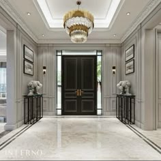 an elegant entry way with chandelier and marble flooring in the foyer area