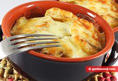 a close up of a casserole dish with a fork