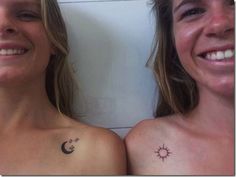 two women with sun and moon tattoos on their chests, both smiling at the camera