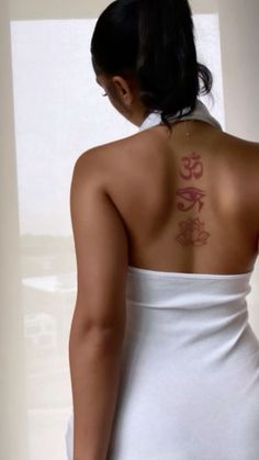 a woman with a tattoo on her back