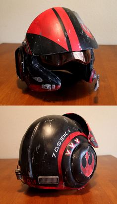 the helmet is black and red with a star wars symbol on it, while the helmet has been painted red